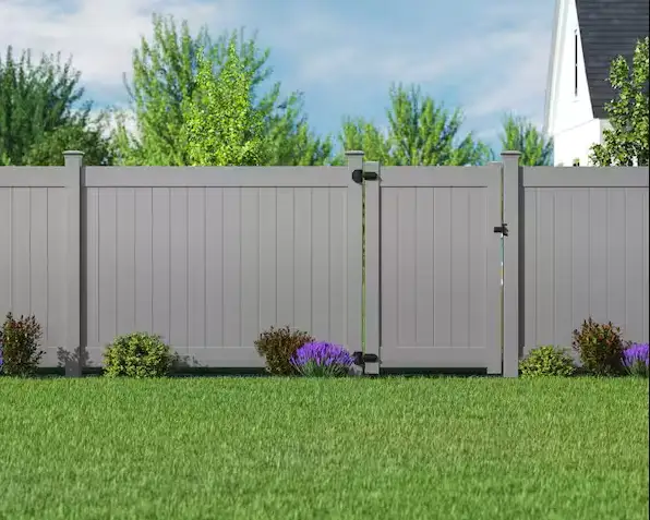 Gray privacy fence with a matching walk gate